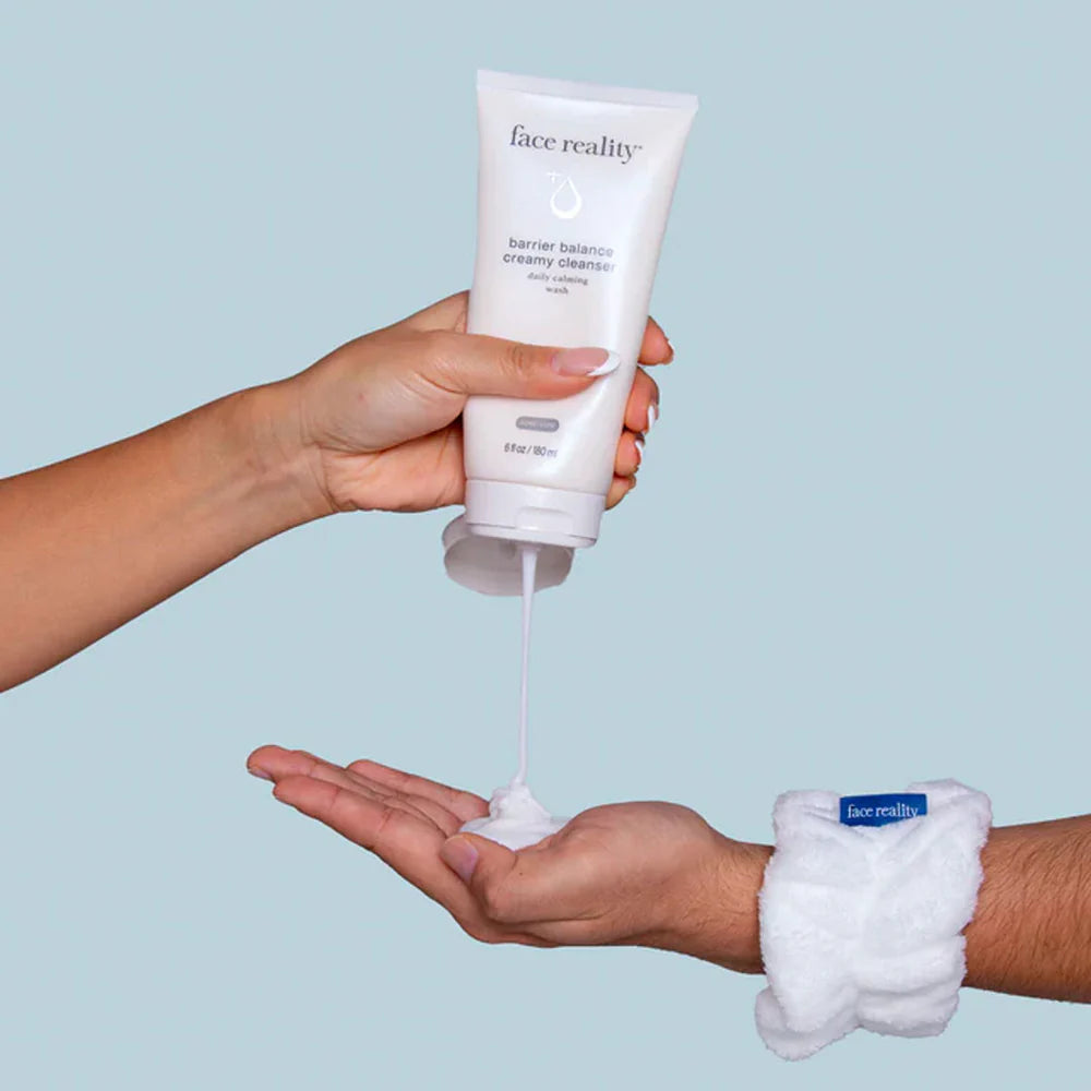 hands squeezing Barrier Balance Creamy Cleanser into palm