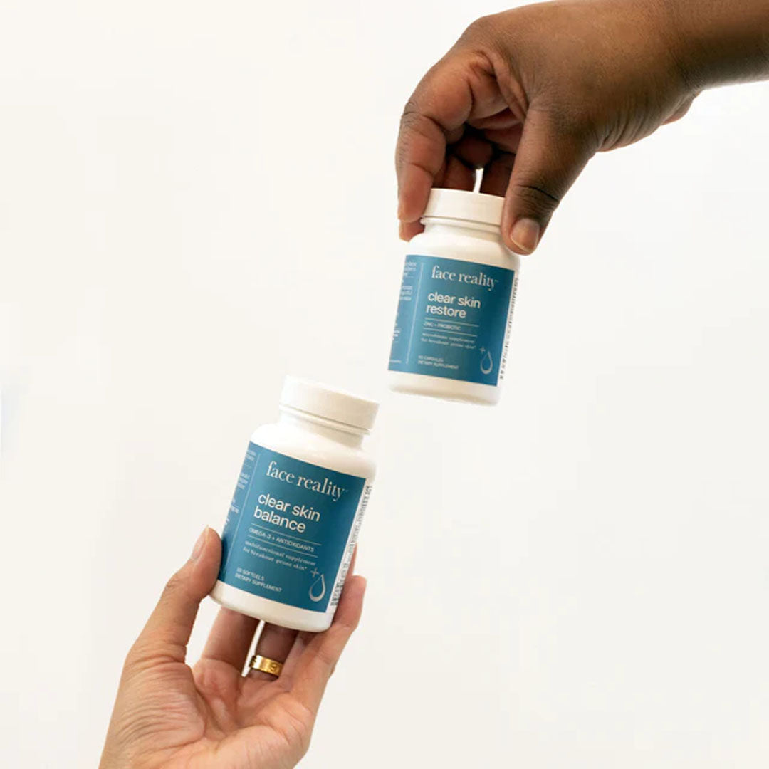 hands holding Clear Skin Supplement Duo