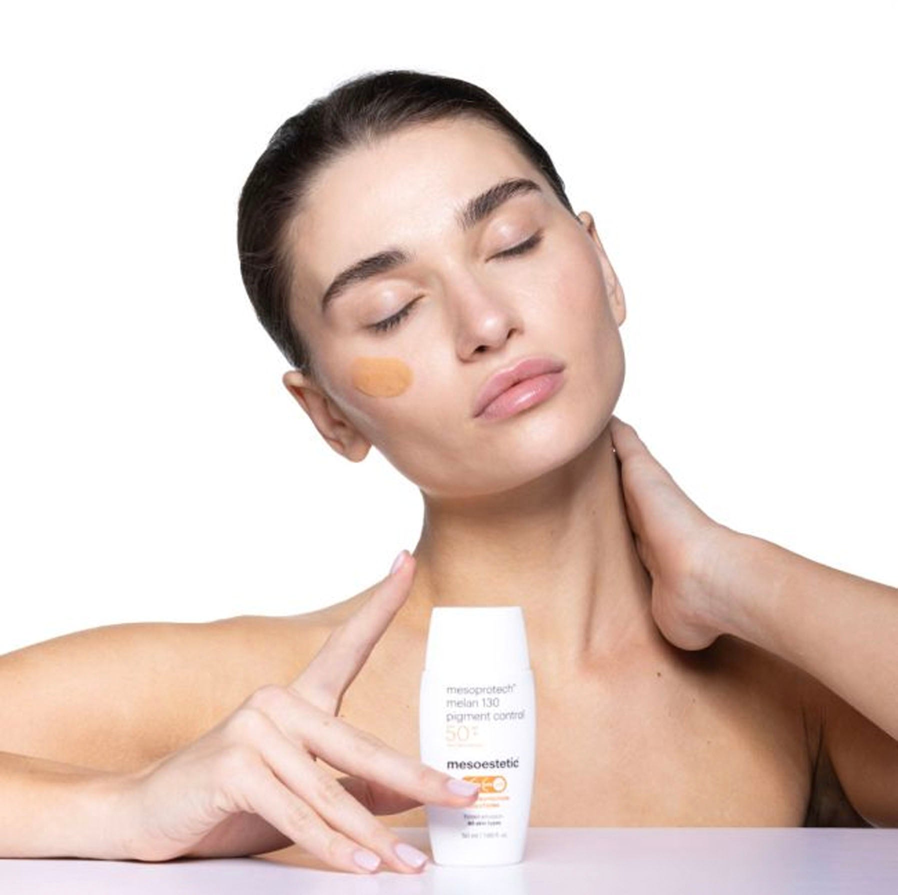 woman using Melan 130 Pigment Control SPF 50+